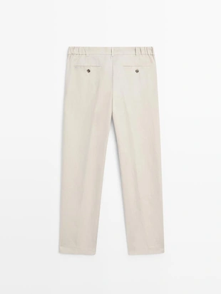 Брюки из льна с зауженным кроем- Заказать в России