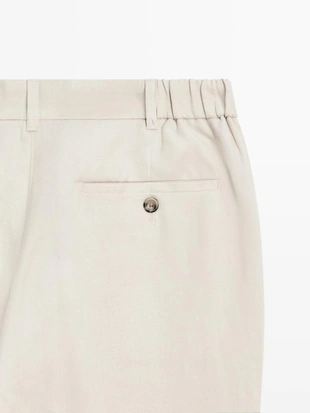 Брюки из льна с зауженным кроем- Заказать в России