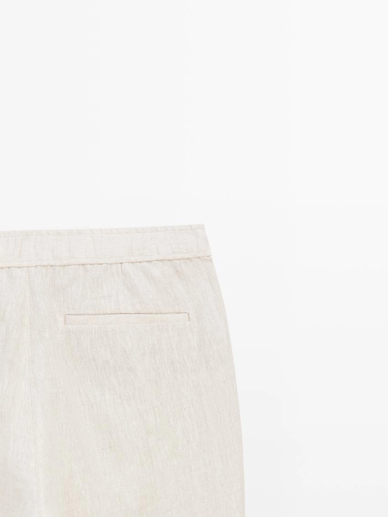 Льняные брюки в стиле джоггер