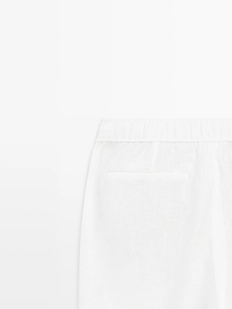 Льняные брюки в стиле джоггер