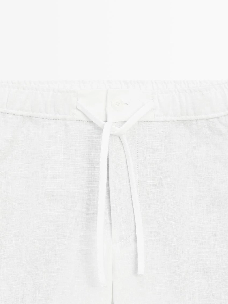 Льняные брюки в стиле джоггер