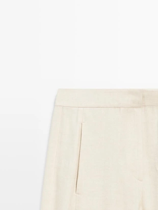 Брюки-костюм из льняной смеси с деталями на пуговицах- Заказать в России