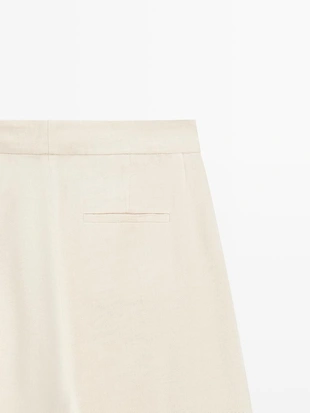 Брюки-костюм из льняной смеси с деталями на пуговицах- Заказать в России