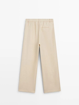 Брюки из 100% льна с широкими штанинами и эластичными деталями- Заказать в России