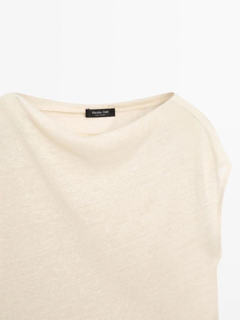 Льняной пальто с асимметричным укороченным кейпом