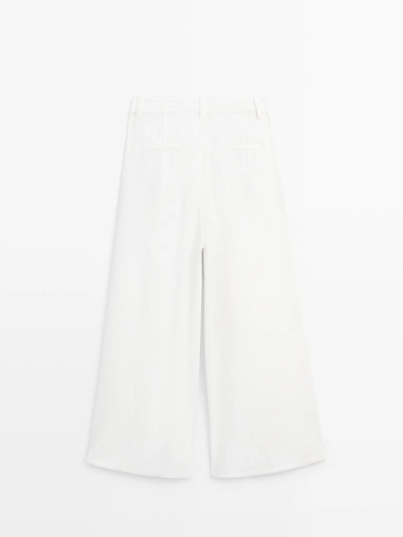 Широкие брюки с защипами