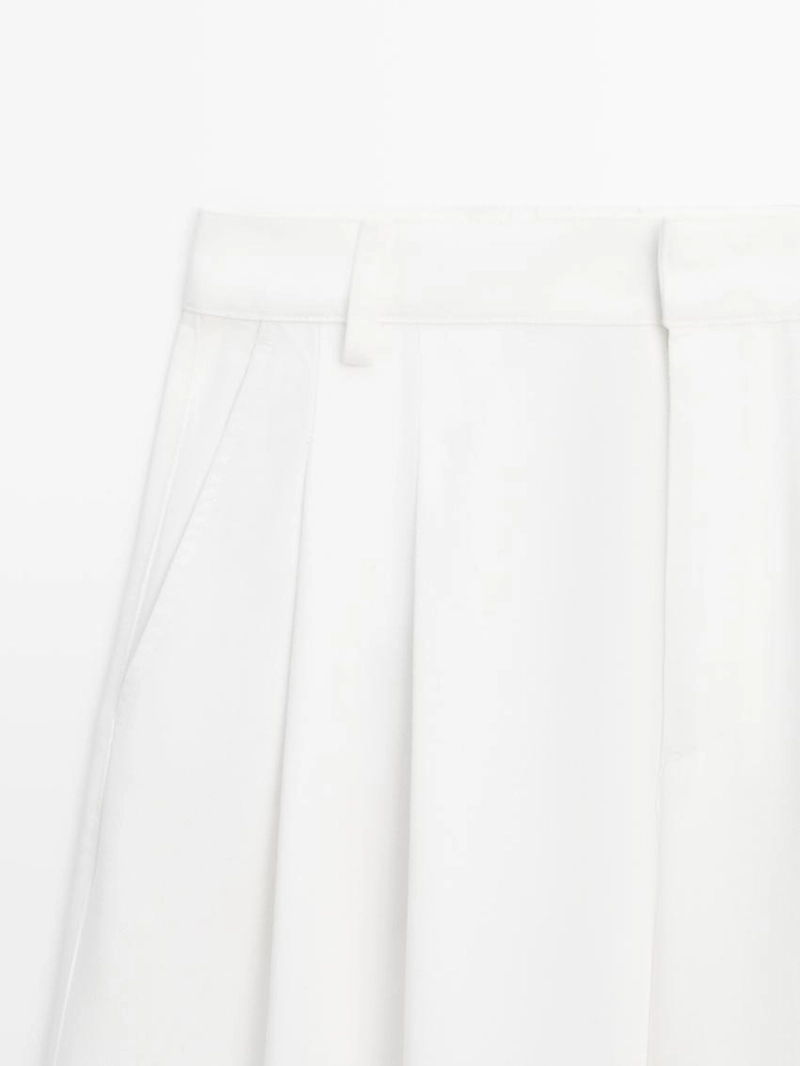 Широкие брюки с защипами