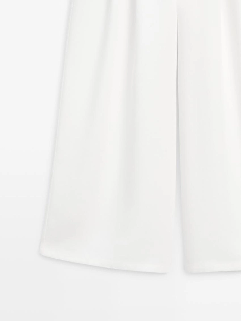 Широкие брюки с защипами