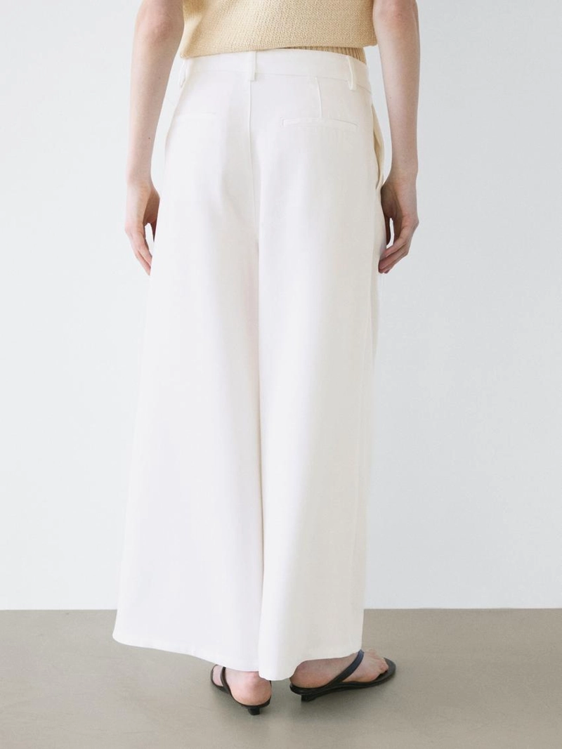 Широкие брюки с защипами