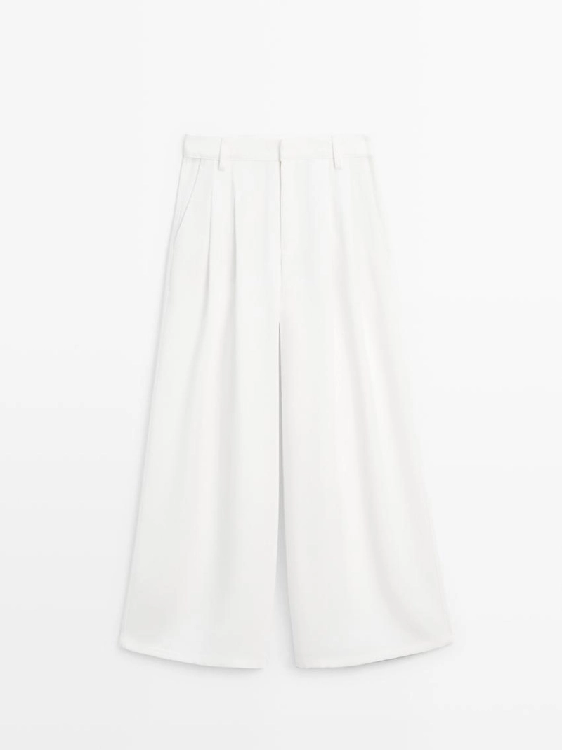 Широкие брюки с защипами