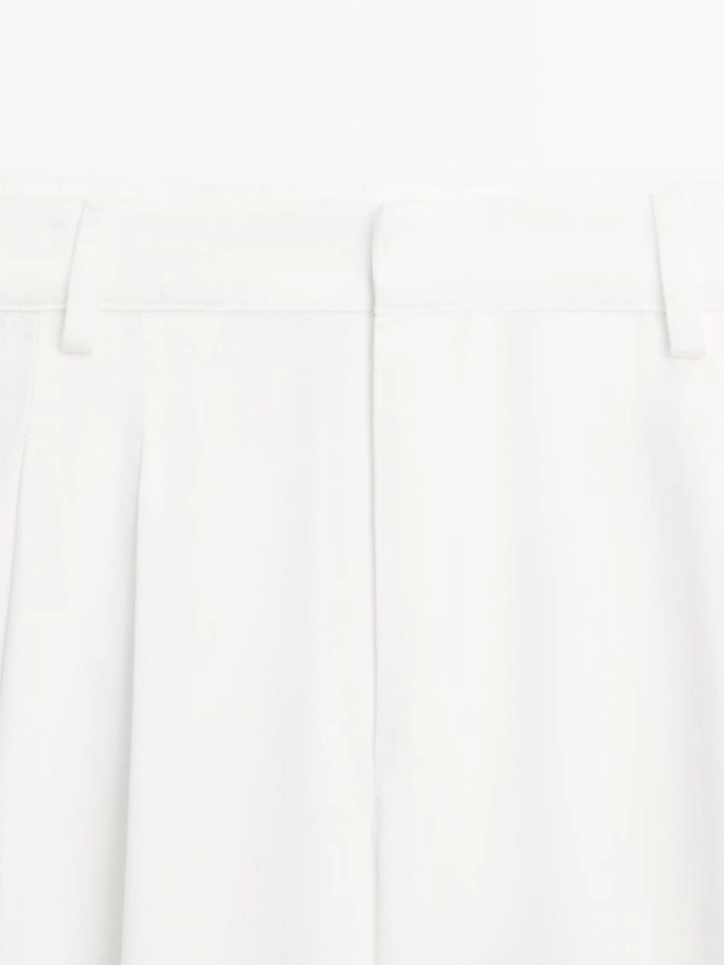 Широкие брюки с защипами