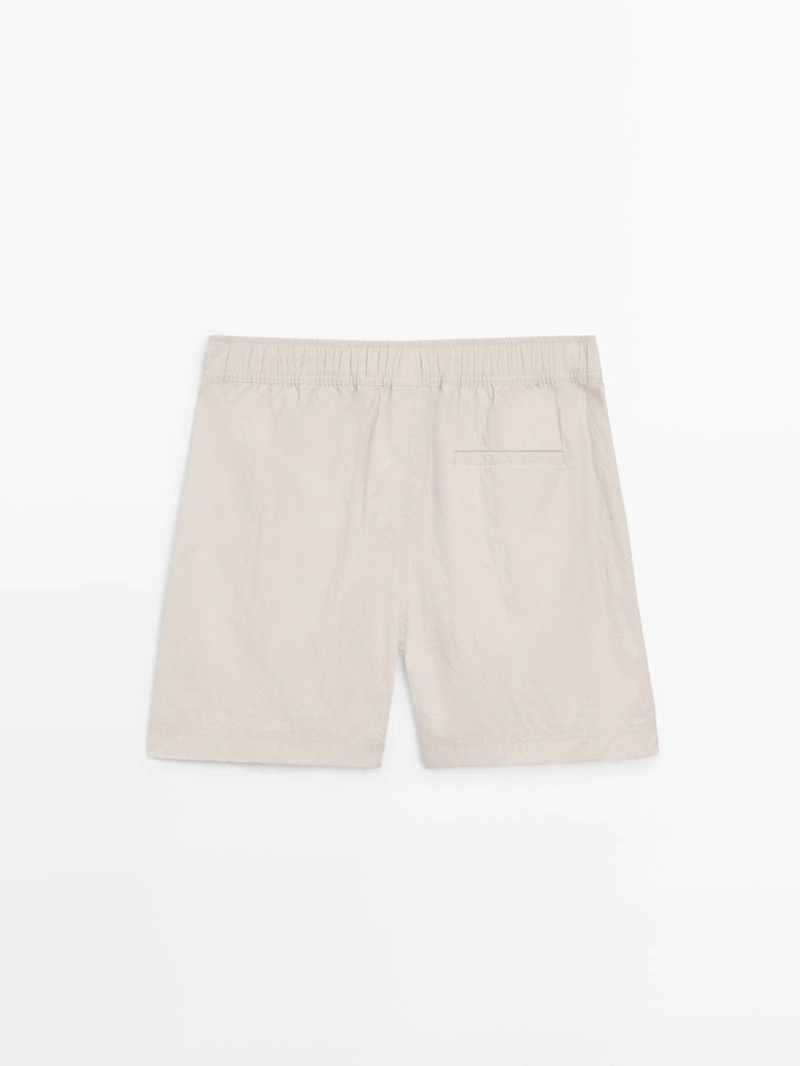 Купальные трусы с деталями на поясе