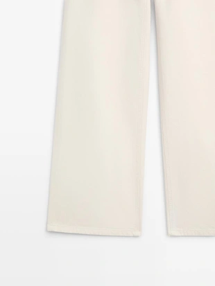 Джинсы с высокой посадкой и широкими брючинами- Заказать в России