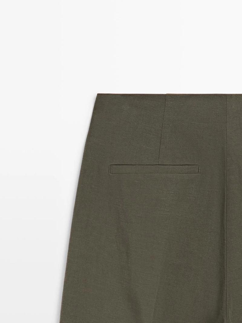 Широкие брюки с защипами