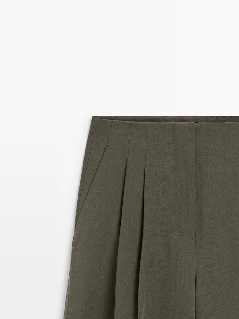 Широкие брюки с защипами