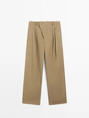 Брюки с защипами и пересекающимся застежкой - studio- Заказать в России