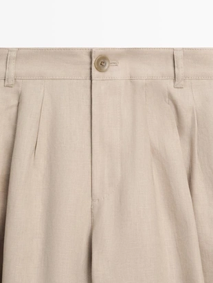 Широкие льняные брюки со складками - studio- Заказать в России