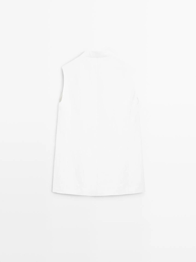 Жилетка, бермуды из текстиля, пальто из хлопковой смеси, миди-юбка годе, миди-платье из кожи. 