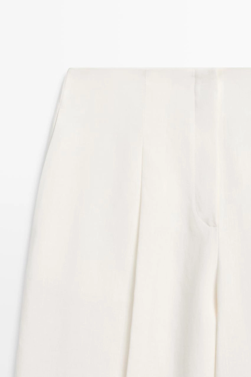 Брюки из льна с драпировкой и манжетами на резинке