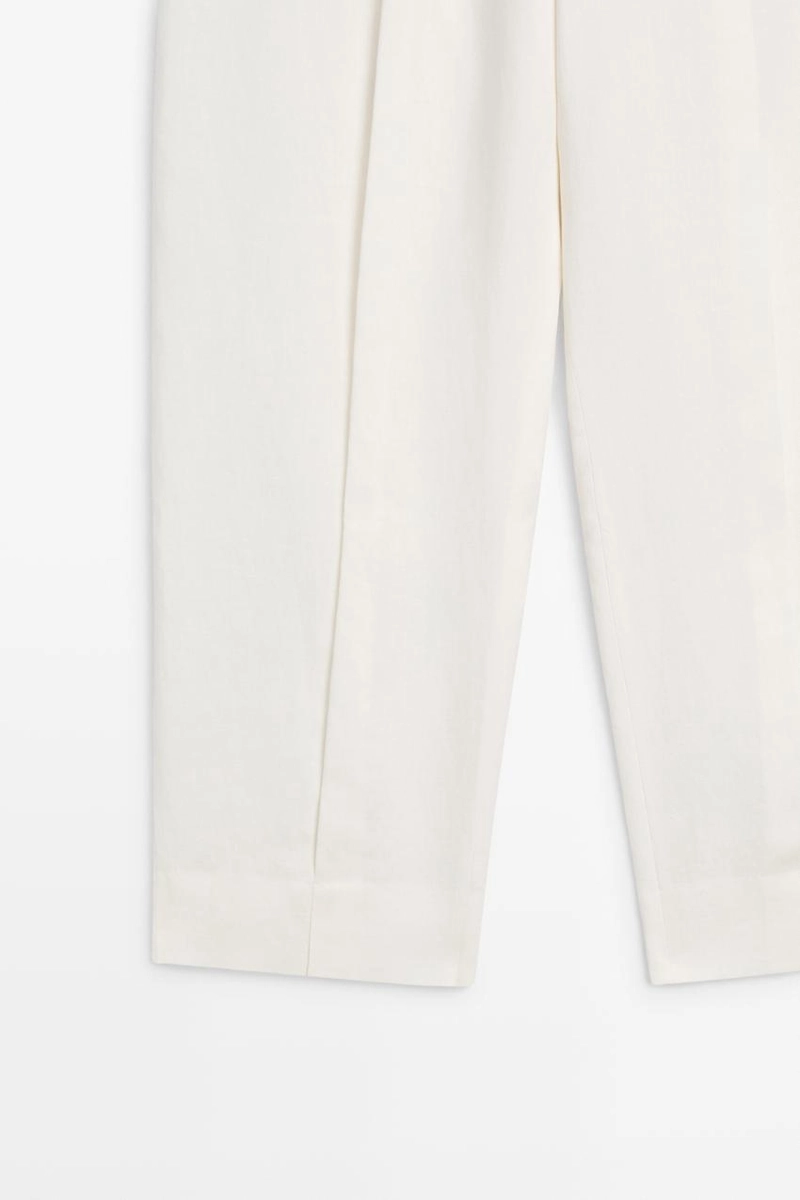 Брюки из льна с драпировкой и манжетами на резинке