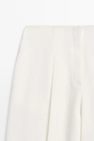 Брюки из льна с драпировкой и манжетами на резинке- Заказать в России