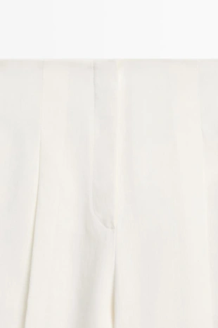 Брюки из льна с драпировкой и манжетами на резинке- Заказать в России