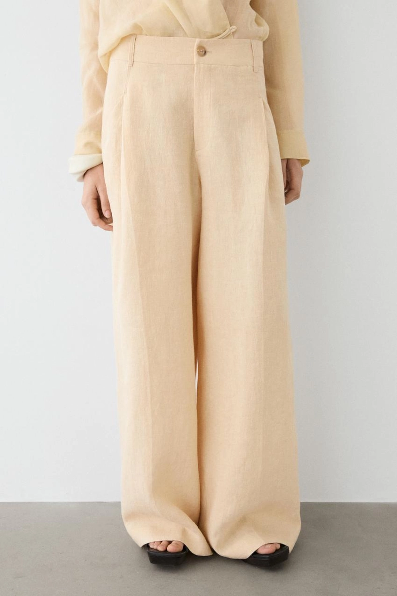 Широкие льняные брюки с карманами