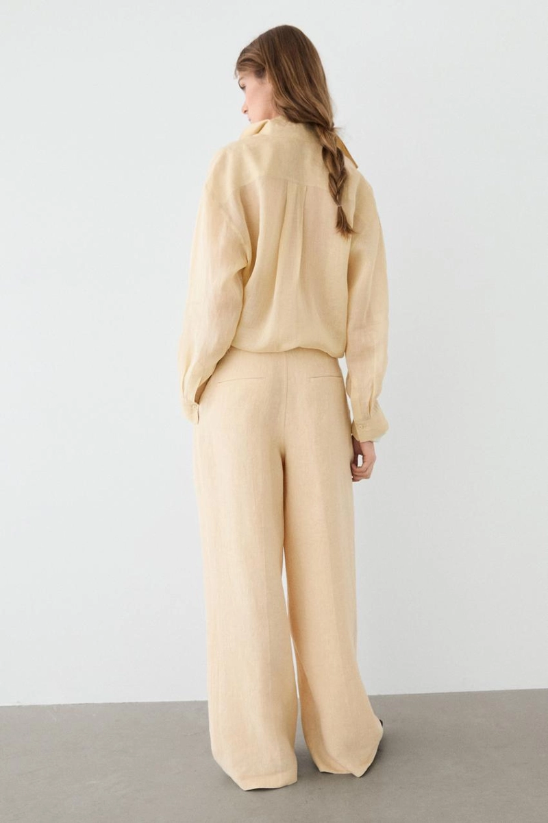 Широкие льняные брюки с карманами