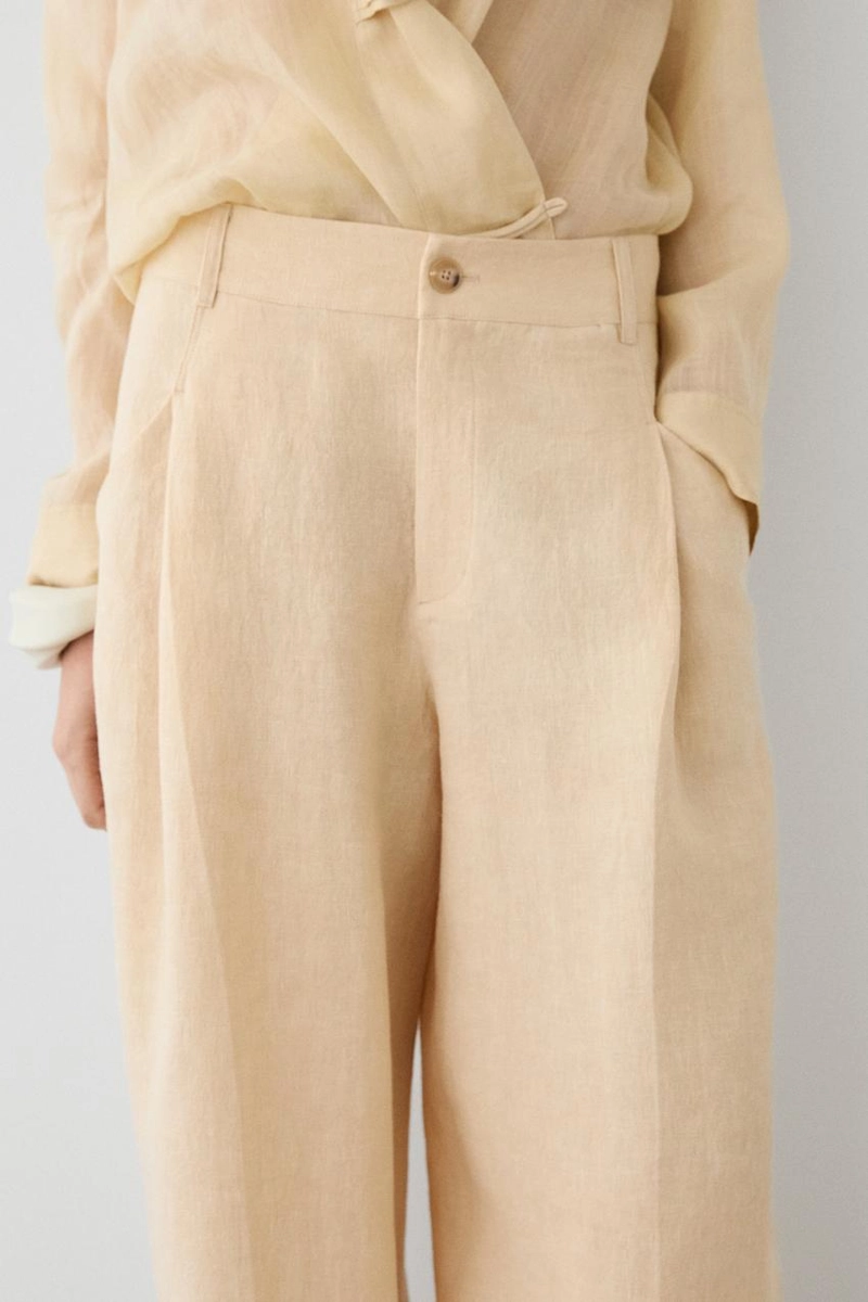 Широкие льняные брюки с карманами