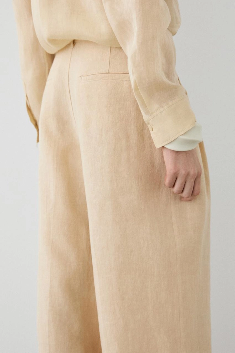 Широкие льняные брюки с карманами