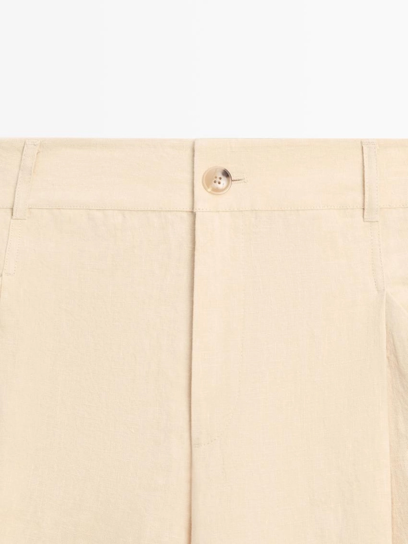 Широкие льняные брюки с карманами