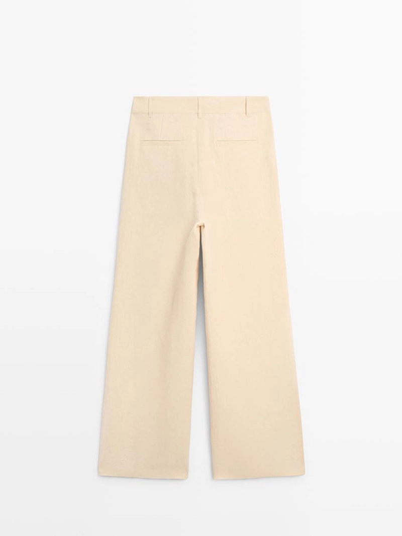 Широкие льняные брюки с карманами