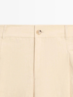 Широкие льняные брюки с карманами- Заказать в России