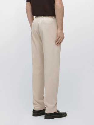 Хлопковые брюки в стиле джоггер из смеси хлопка- Заказать в России