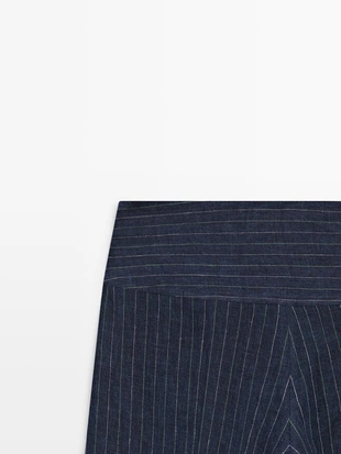 Брюки из льна с зауженными штанинами и полосатыми деталями- Заказать в России