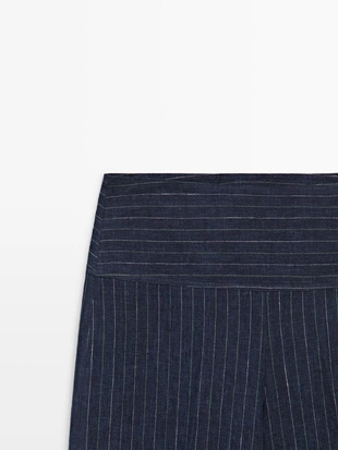 Брюки из льна с зауженными штанинами и полосатыми деталями- Заказать в России