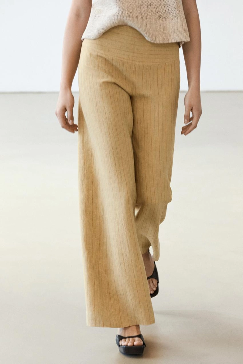 Брюки из льна с расширяющимся кроем и полосатыми деталями