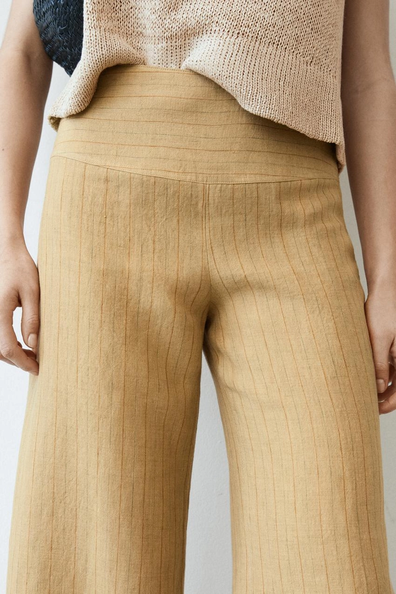 Брюки из льна с расширяющимся кроем и полосатыми деталями