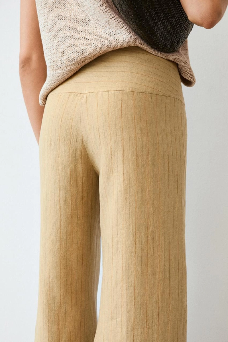 Брюки из льна с расширяющимся кроем и полосатыми деталями