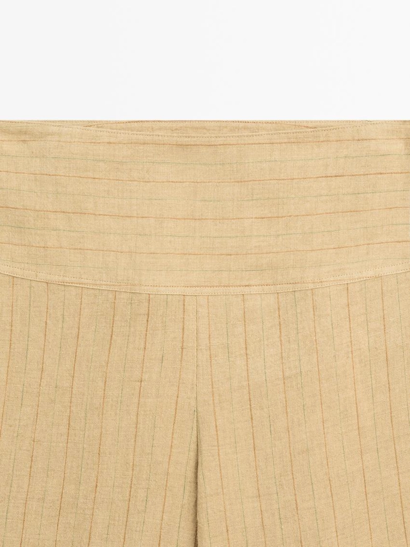 Брюки из льна с расширяющимся кроем и полосатыми деталями