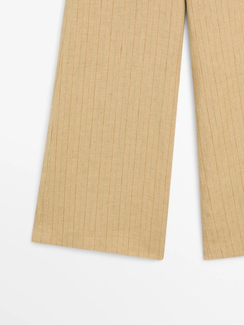 Брюки из льна с расширяющимся кроем и полосатыми деталями