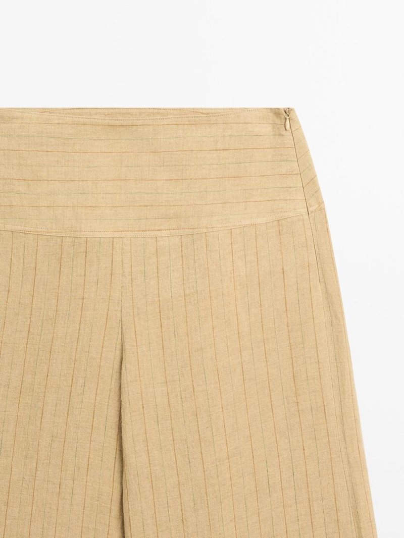 Брюки из льна с расширяющимся кроем и полосатыми деталями