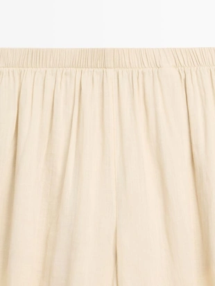 Брюки саруэль из льна свободного кроя- Заказать в России