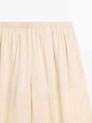 Брюки саруэль из льна свободного кроя- Заказать в России