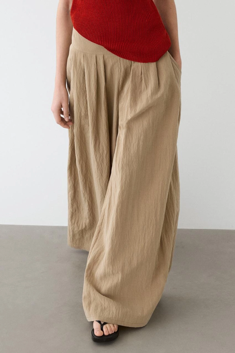 Брюки палаццо с накладными складками