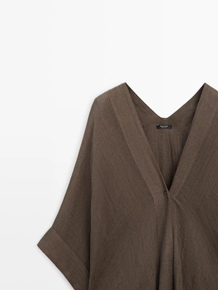 Раскатистая блузка oversize из 100% льна с деталями на спинке- Заказать в России