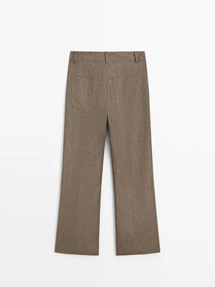 Брюки из льна с укороченным разрезом и зауженными штанинами- Заказать в России