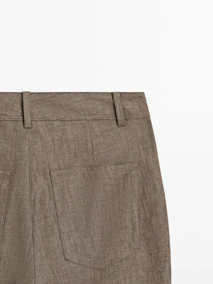 Брюки из льна с укороченным разрезом и зауженными штанинами- Заказать в России