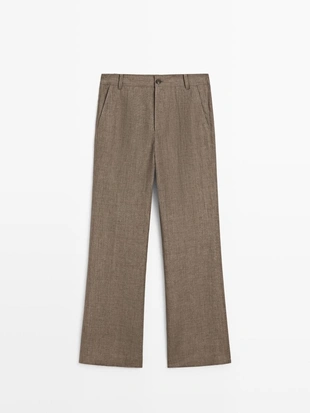 Брюки из льна с укороченным разрезом и зауженными штанинами- Заказать в России