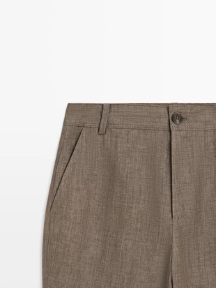 Брюки из льна с укороченным разрезом и зауженными штанинами- Заказать в России